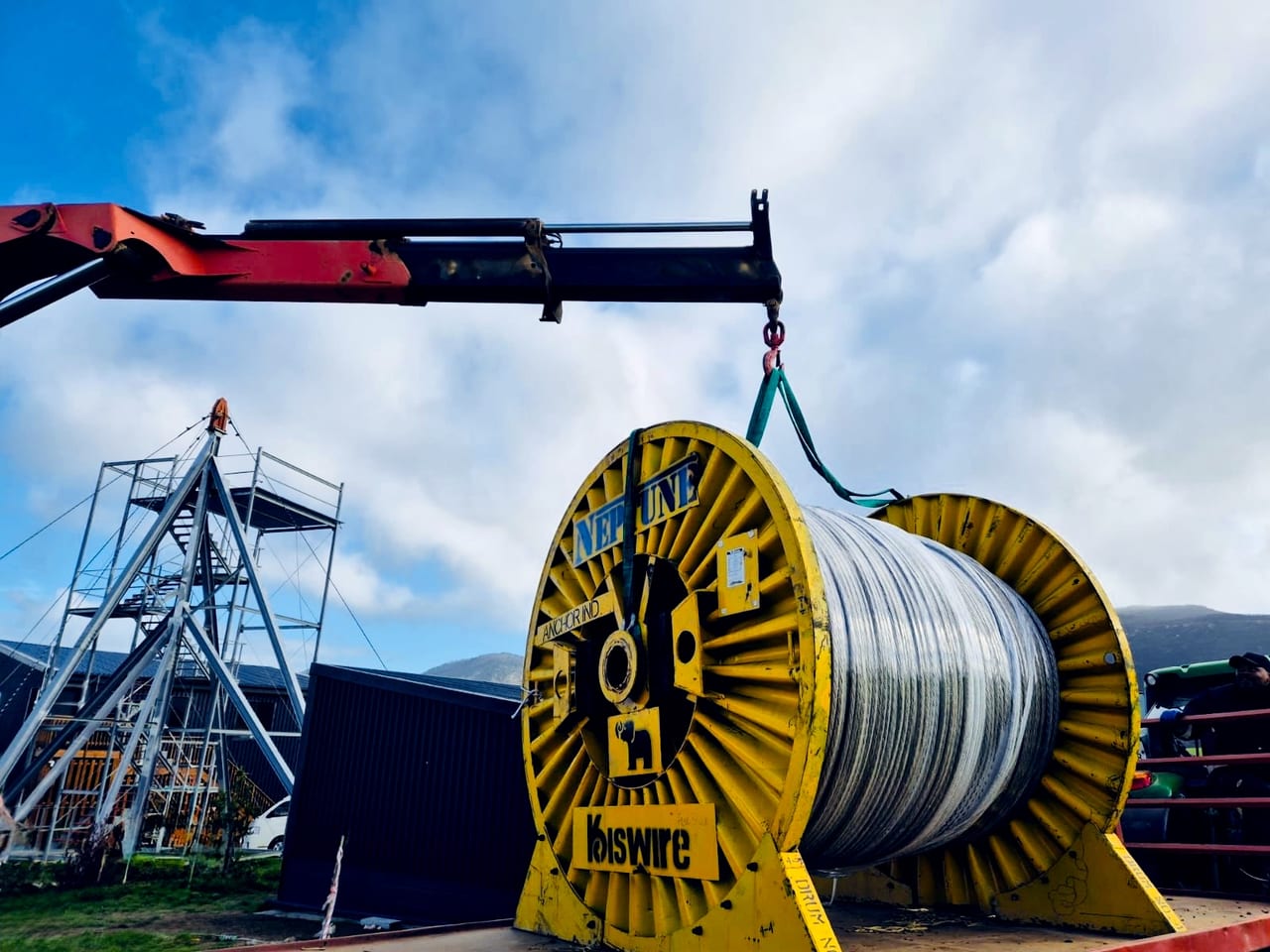Crane lifting a Neptune Kiswire wire-rope drum at an Afrishore lifting and rigging operation in Mossel Bay